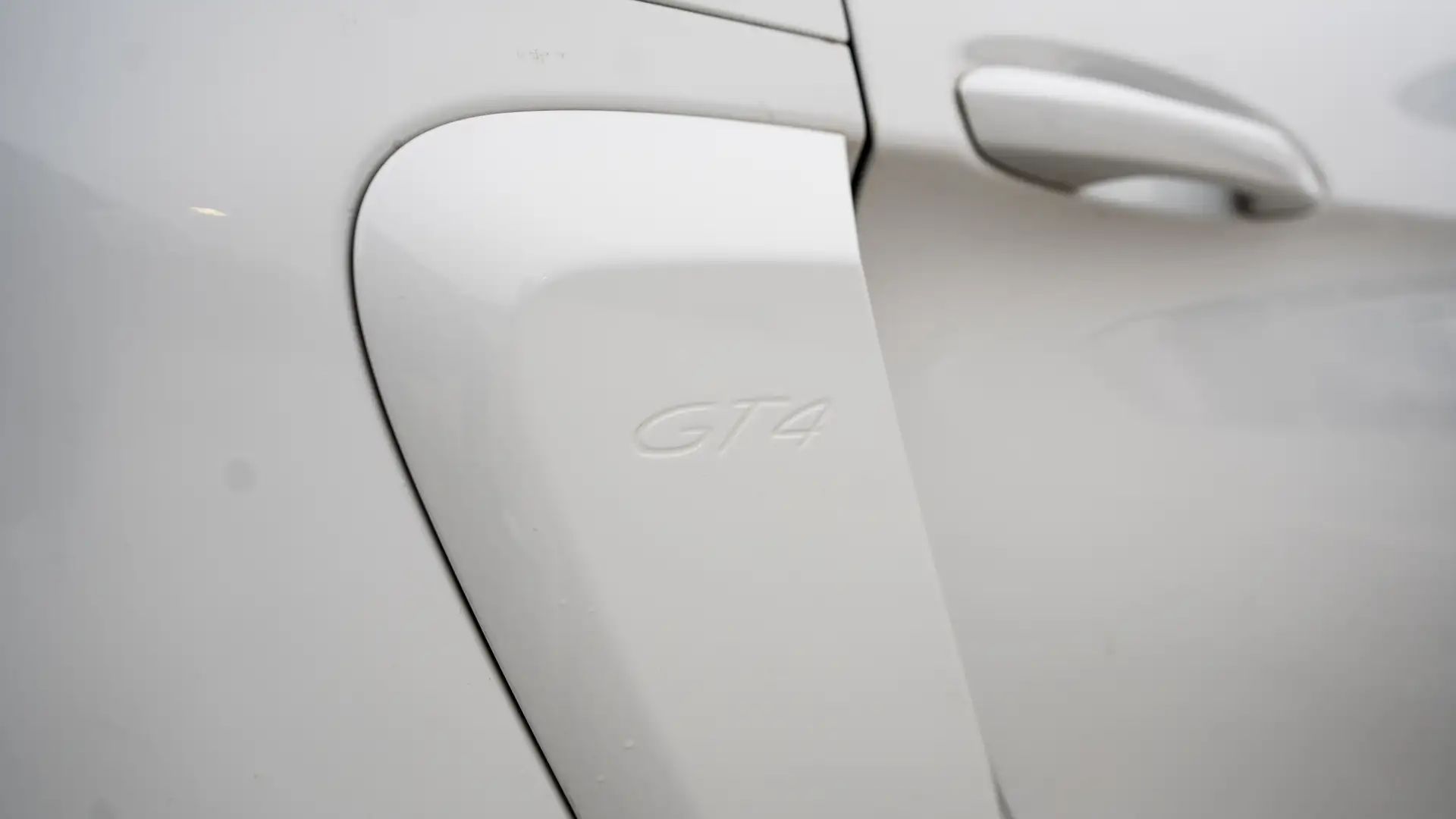 The lettering on the rear of our white Porsche GT4.